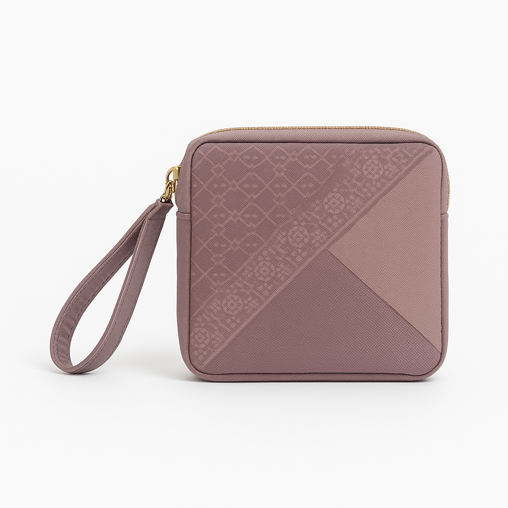 Dusty mauve Travel Prayer Set pouch with geometric patchwork panels, gold zip and wrist strap — Patchwork, Maison Haya